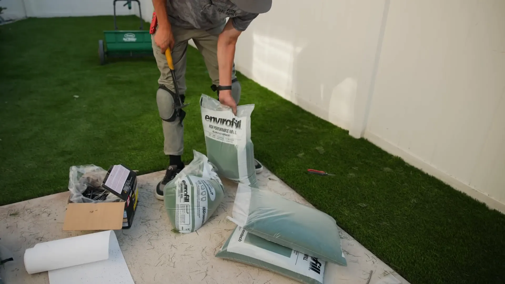 Applying infill to synthetic turf using drop spreader
